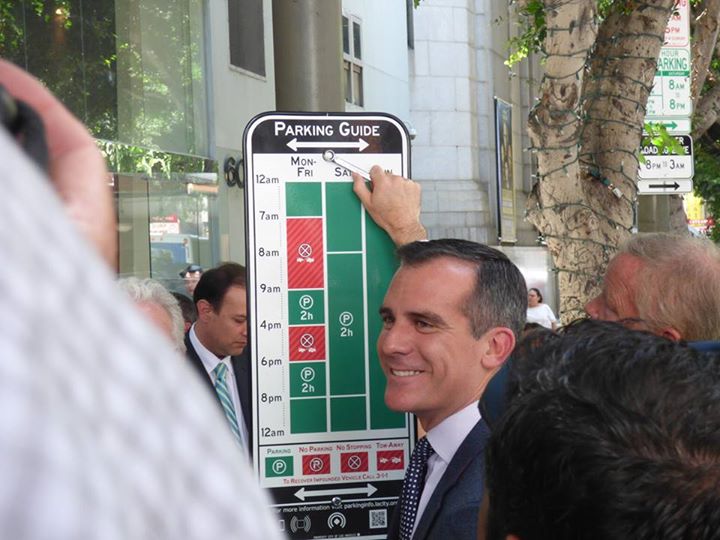 Los Angeles Mayor Eric Garcetti unveils a pilot test of new parking signs based on Sylianteng’s designs.