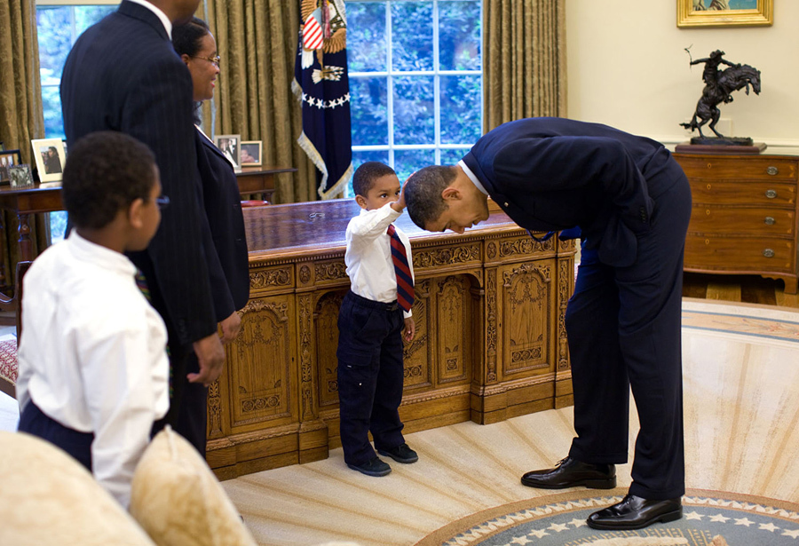President Obama with Young Boy by Pete Souza