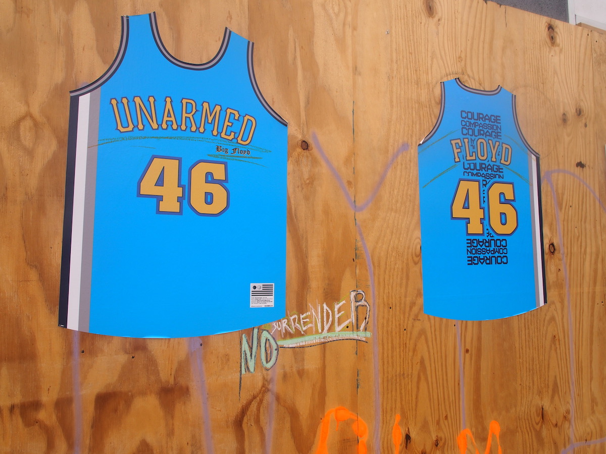 Close-up Photo of “Unarmed: George Floyd” Jersey on Flatbush Avenue
