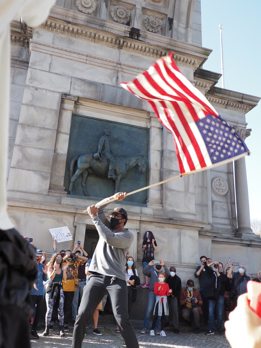 A man waves an American flag at Grand Army Plaza, Brooklyn, Copyright 2020 by Khoi Vinh