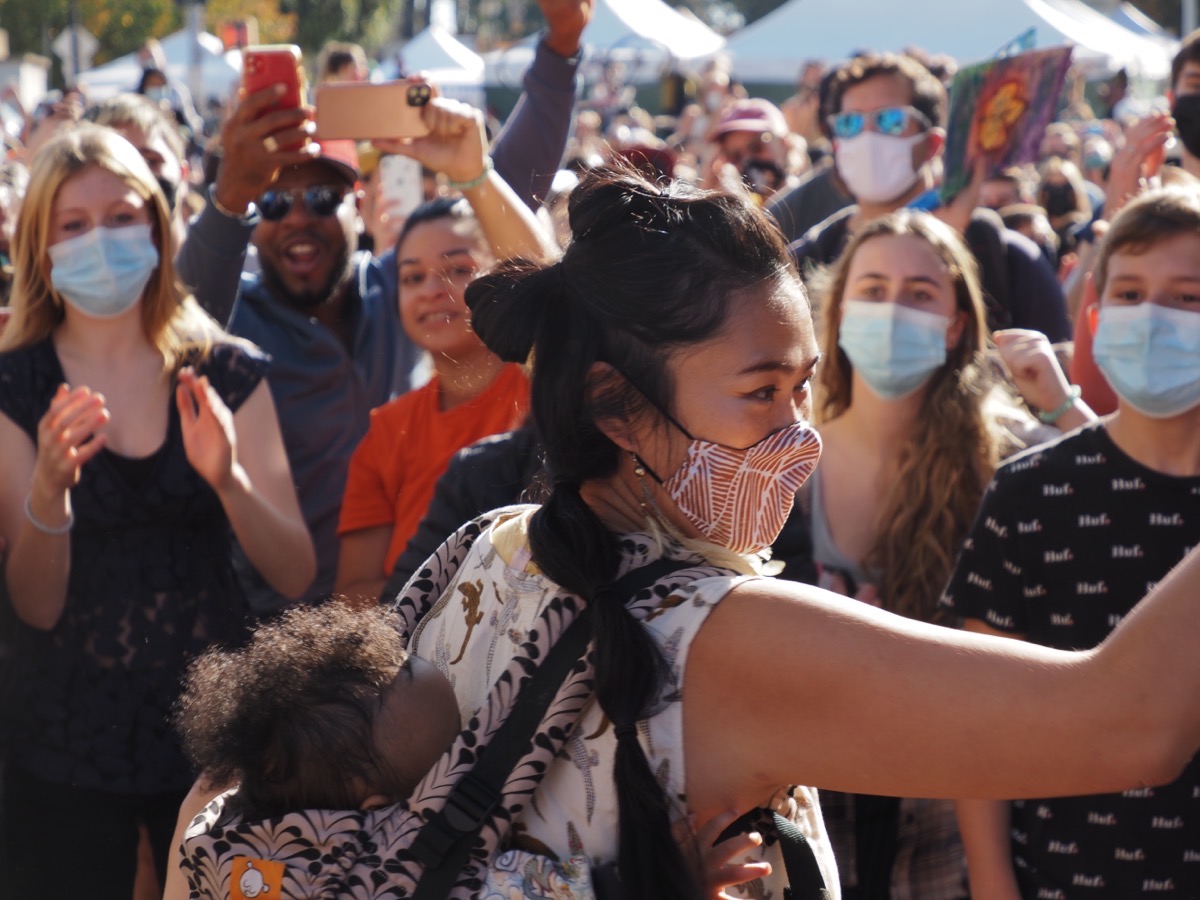 A woman dancing with her child at Grand Army Plaza, Brooklyn, Copyright 2020 by Khoi Vinh